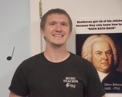 Trumpet, Guitar and Piano Teacher Alex Bon Smiling.